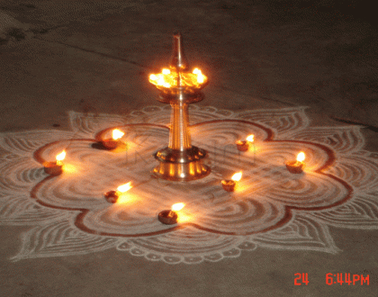 Rangoli: Traditional design with lamps