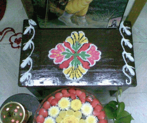 Rangoli: Glass bowl filled with water and flowers