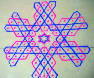 Rangoli: mOhanaji's hexagonal kolam no. 10 on the floor.