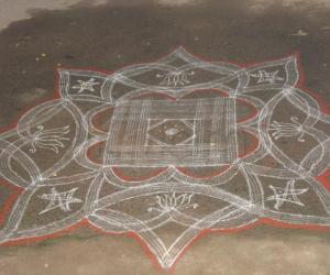 Rangoli: Varalakshmi nombu  - Kuzhal kolam outside the compound