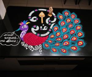 2021- Thai Poosam- Peacock, Vel (spear) and Foral Om...The main floral, big tamil letter is ‘OM” The meaning of the tamil writing (as a speech bubble) in a short poetic way - “ The peacock with pride says- ‘OF ALL THE ANIMALS AND BIRDS THE LORD CHOSE ME (