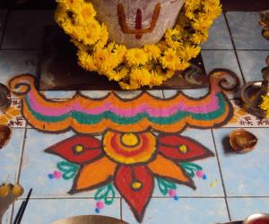 Rangoli: kolam in front of tulsi