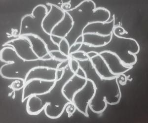 9 to 5 kolam flower with peacock 