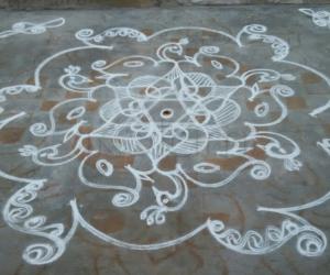 Rangoli: Elephants and peacocks in a star