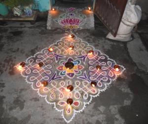 Chikku kolam with flower on karthigai deepam.