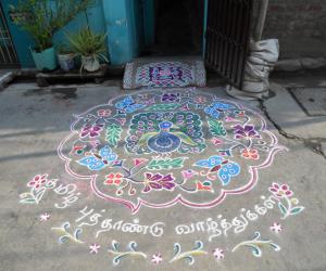 Rangoli: Tamil Puthandu Vazuthukal in advance. Dancing Peacock & Butterflies with flowers.