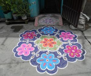Rangoli: Chikku kolam & flower kolam combined.