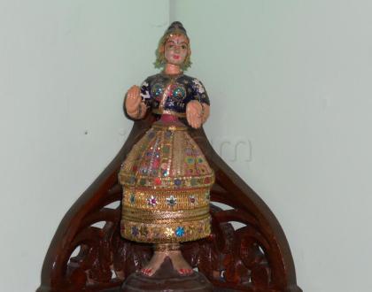 Thanjavur thalaiatti bommai decorated with chemkies.