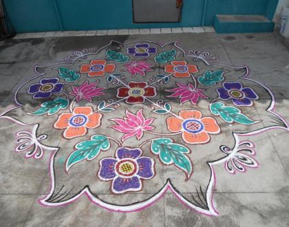 Flower kolam with lotus & leaves in different style.