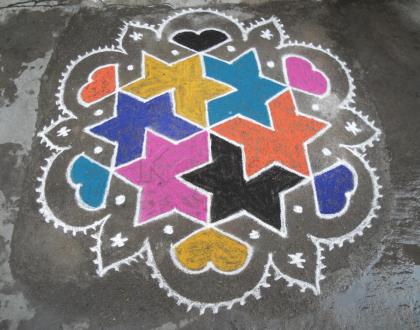 Rangoli: Star with in star, in bright colours.