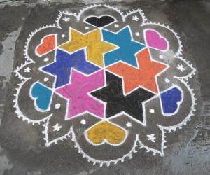 Rangoli: Star with in star, in bright colours.