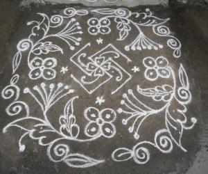 Rangoli: Swasthik & flowers kolam.