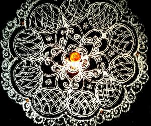Friday pooja kolam with rice flour.