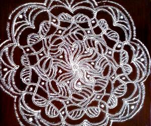 Rangoli: freehand rangoli with rice flour