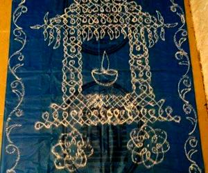 Rangoli: Ther kolam in chikku pattern with rice flour