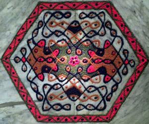 Rangoli: A butterfly chikku with 11-6 interlaced dots