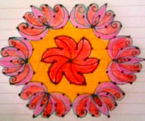 Floral rangoli with 11- 6 interlaced dots