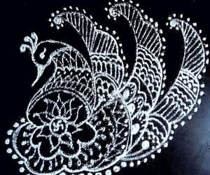 Rangoli: Freehand peacock rangoli with lotus and small swastik 
