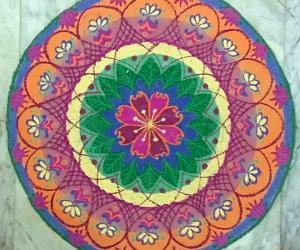 Margazhi Day 7- A freehand floral rangoli with colours 