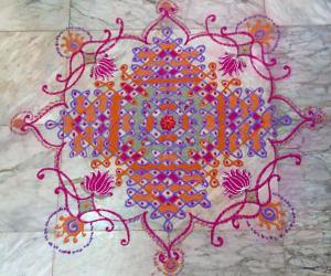 Multi coloured chikku kolam with freehand extension. 