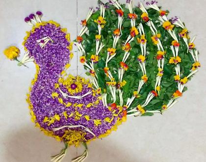 Pookolam 012 - Peacock with fresh flowers.