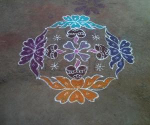 Rangoli: lamp on flowers