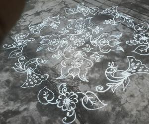 Rangoli: Flower kolam with peacocks
