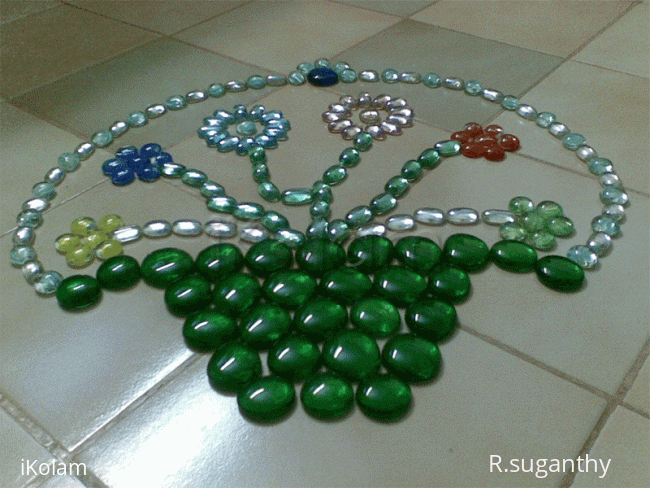 Rangoli: Kolam made with fish tank stones Rangoli: Kolam made with fish tank stones