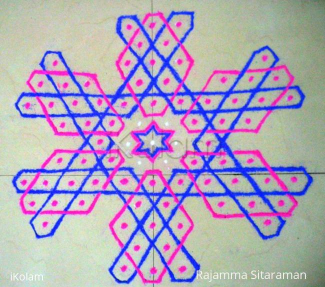 Rangoli: mOhanaji's hexagonal kolam no. 10 on the floor. Rangoli: mOhanaji's hexagonal kolam no. 10 on the floor.