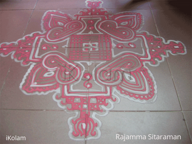 Rangoli: Red and white Padi Kolam Rangoli: Red and white Padi Kolam