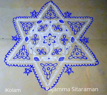 Rangoli: white/violet fusion kolam. Rangoli: white/violet fusion kolam.