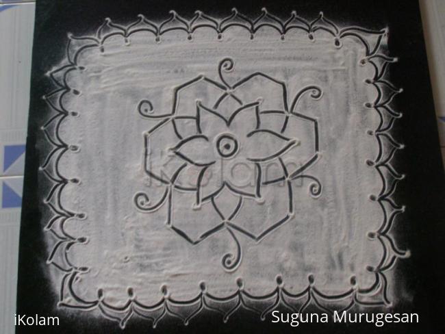 Rangoli: black kolam on white base Rangoli: black kolam on white base