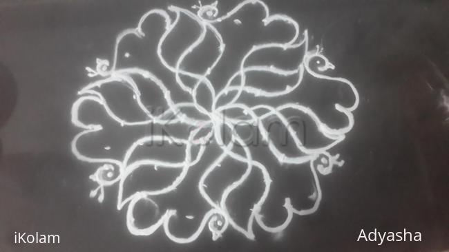 Rangoli: 9 to 5 kolam flower with peacock Rangoli: 9 to 5 kolam flower with peacock