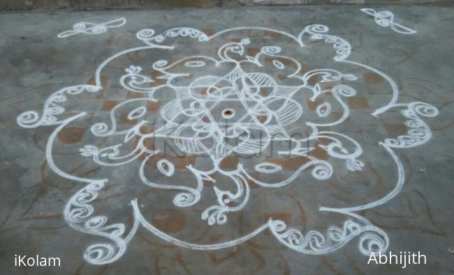 Rangoli: Elephants and peacocks in a star Rangoli: Elephants and peacocks in a star