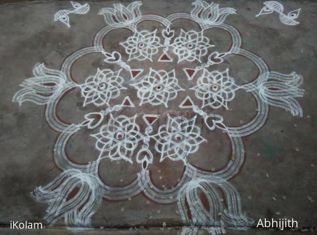 Rangoli: Star Kolam with vilakku Rangoli: Star Kolam with vilakku