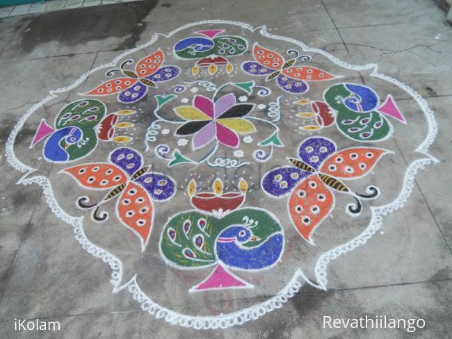 Rangoli: Peacock deepam & butterfly kolam . Rangoli: Peacock deepam & butterfly kolam .