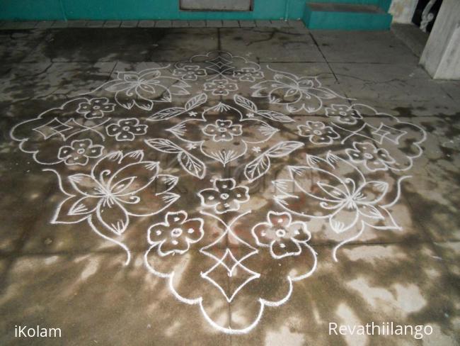 Rangoli: Lotus kolam in white. Rangoli: Lotus kolam in white.