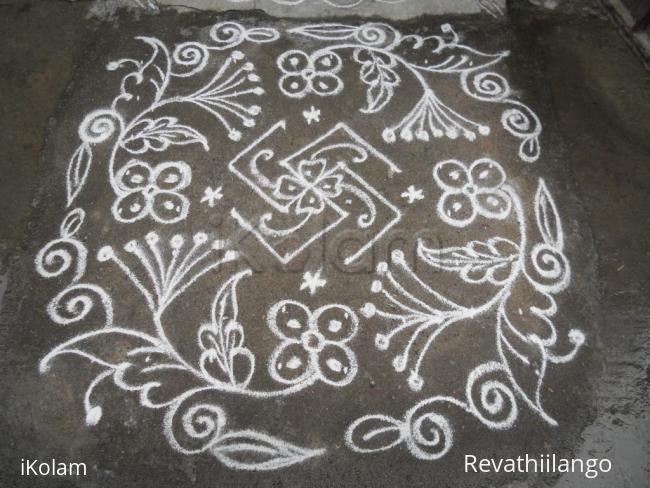 Rangoli: Swasthik & flowers kolam. Rangoli: Swasthik & flowers kolam.