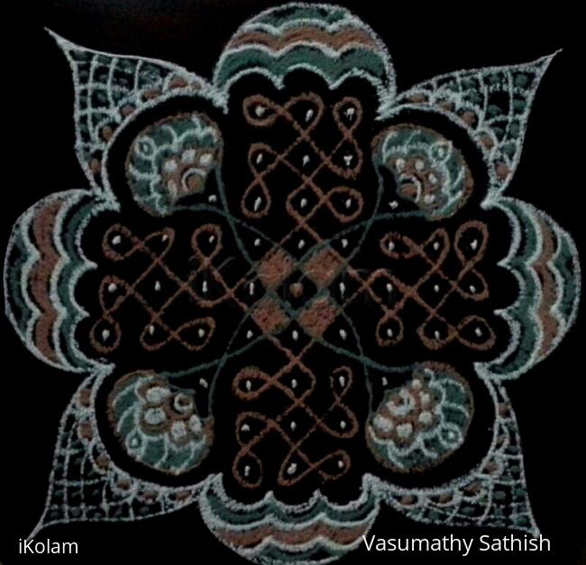 Rangoli: Chikku kolam with 9 dots 3 lines, 5 dots 1line, 3dots 2 lines.
