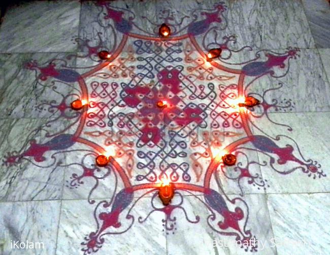 Rangoli: Chikku kolam with diya (15dots 5lines till 5 straight dots). Rangoli: Chikku kolam with diya (15dots 5lines till 5 straight dots).
