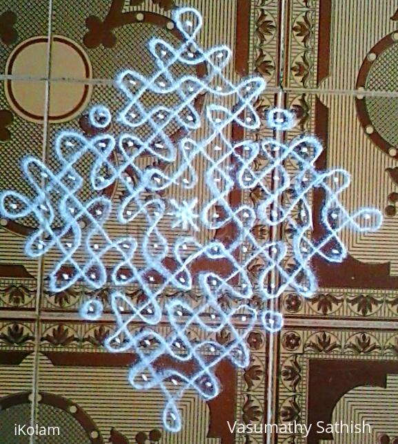 Rangoli: Chikku kolam with 13-1 straight dots.