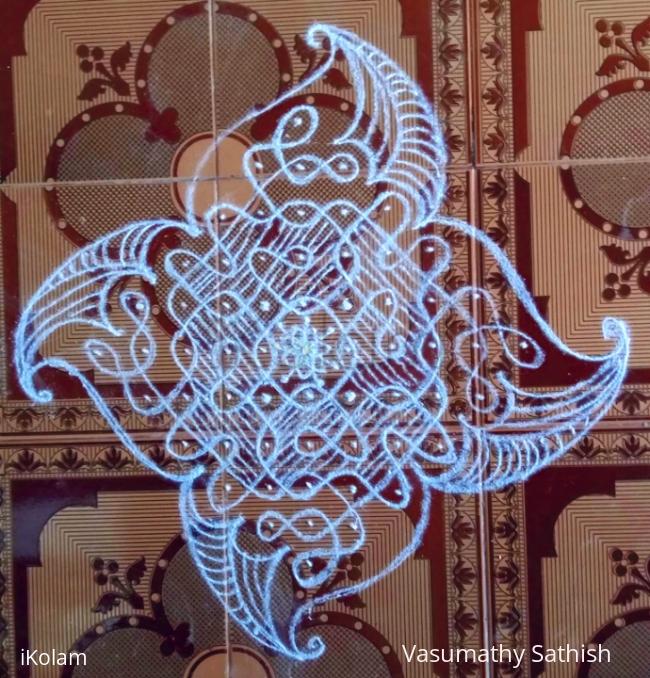 Rangoli: Chikku kolam with 11-1 straight dots.