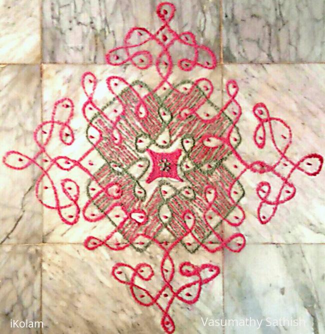 Rangoli: Chikku  kolam  with  13-1  straight  dots. 
