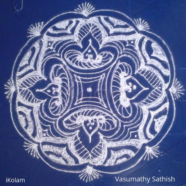 Rangoli: A padi kolam with kolamavu. Rangoli: A padi kolam with kolamavu.