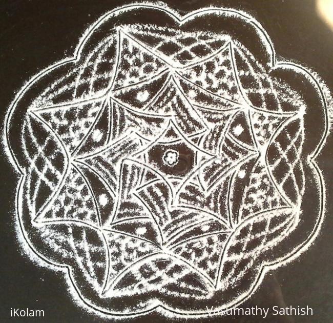 Rangoli: Padi kolam with rice flour Rangoli: Padi kolam with rice flour
