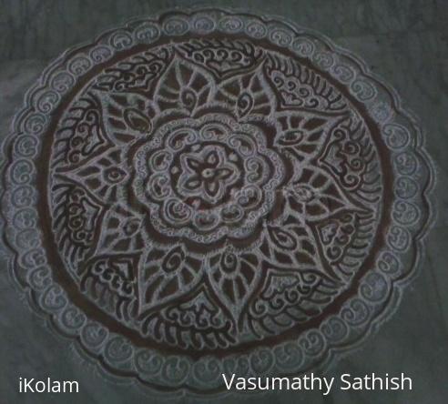 Rangoli: Free hand kolam with rice flour and kavi for margazhi