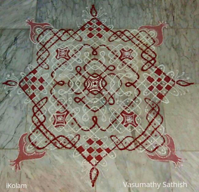 Rangoli: Margazhi Day 24 kolam - A chikku padi kolam with rice flour n red colour. 15-15 straight dots n 5,3,1 on all side in the centre Rangoli: Margazhi Day 24 kolam - A chikku padi kolam with rice flour n red colour. 15-15 straight dots n 5,3,1 on all side in the centre