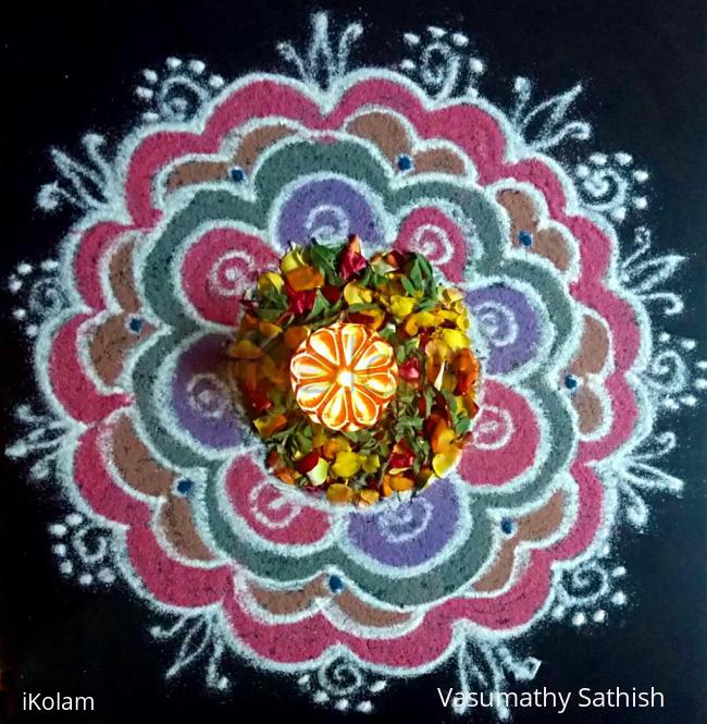 Rangoli: Pooja kolam freehand with flowers n colours. Rangoli: Pooja kolam freehand with flowers n colours.