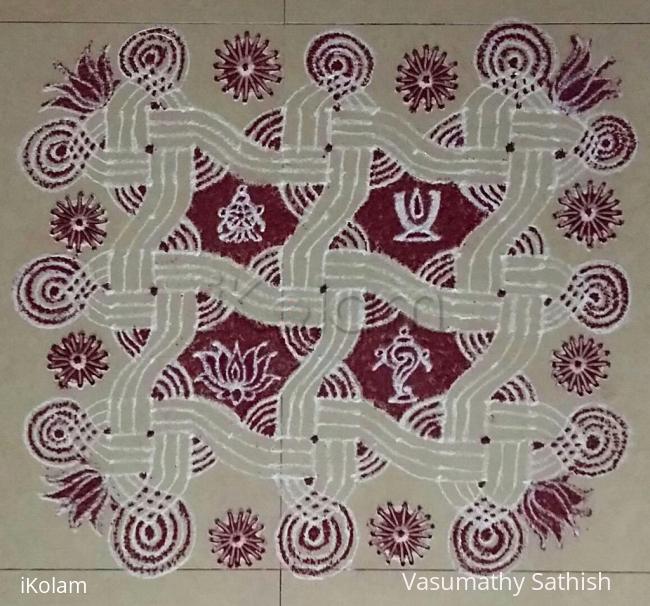 Rangoli: Swastik Padi kolam with Chakra, Shangu, Thirumann and Lotus for Narasimha Jay anti. 