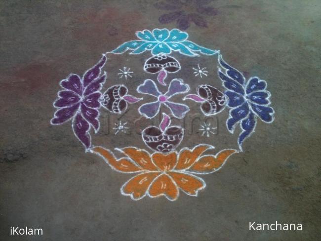 Rangoli: lamp on flowers